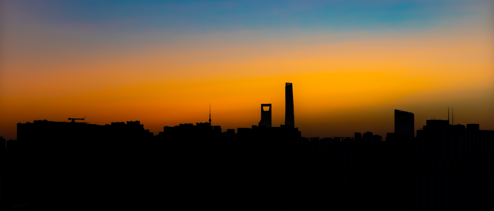 Shanghai’s skyline at sunset, photographed from across the city.